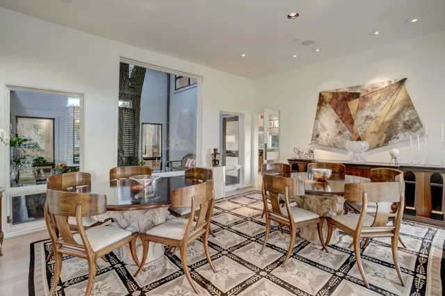 a living room with lots of furniture and painting on the wall