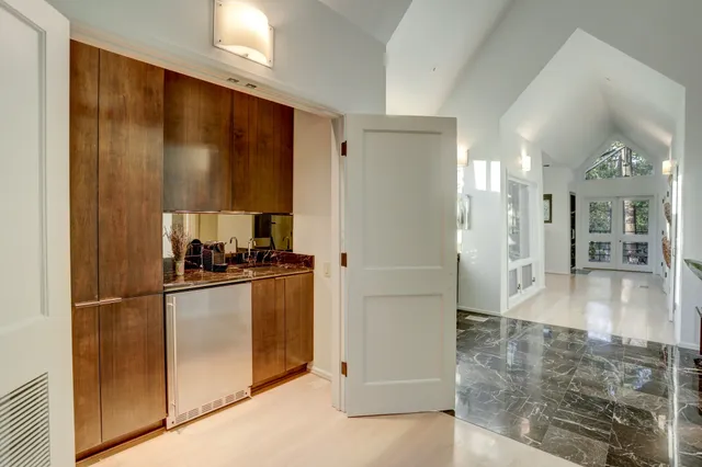 a kitchen with stainless steel appliances granite countertop a refrigerator and a stove