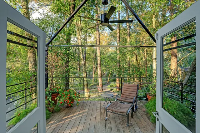 a view of a chairs and table on the wooden deck