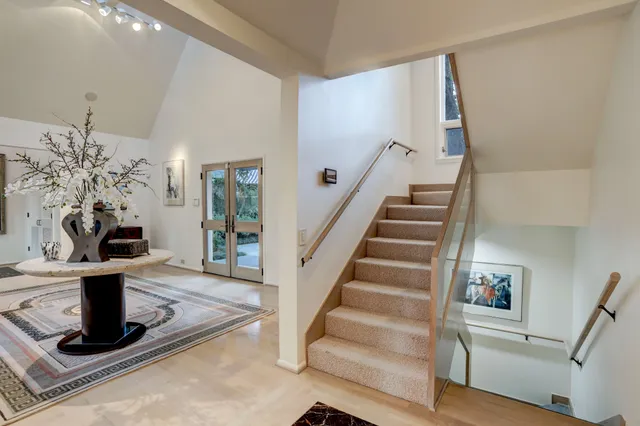 a kitchen with stainless steel appliances granite countertop a refrigerator and a stove