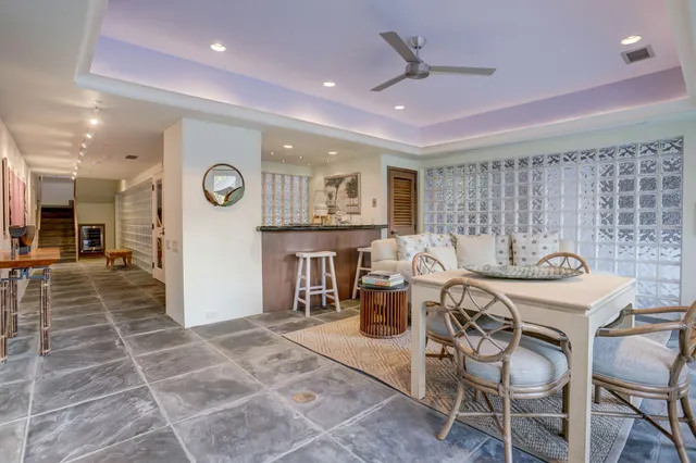 a room with gym equipment and large window