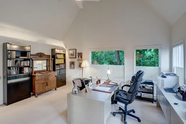a bathroom with a granite countertop sink mirror and a shower