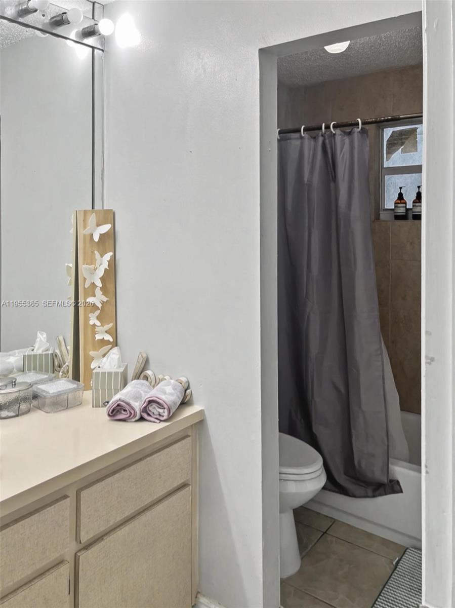 1712 Southwest 13th Street Miami, FL 33145 - Photo 42 of 44 a bathroom with a sink a toilet and shower