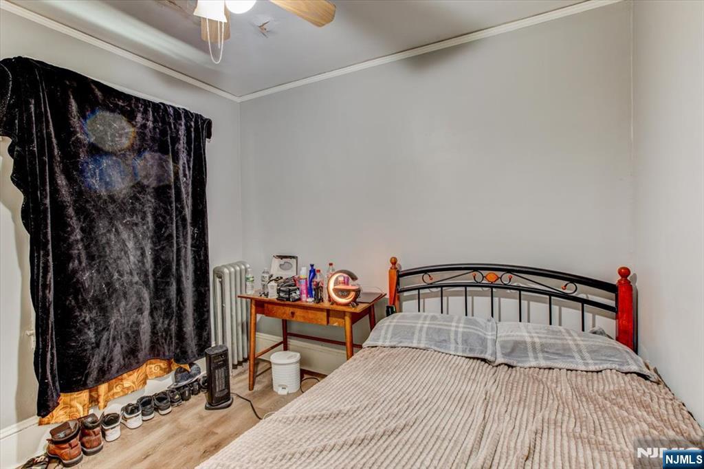 162 Summer Street Orange, NJ 07050 - Photo 11 of 29 a bedroom with a bed and a window