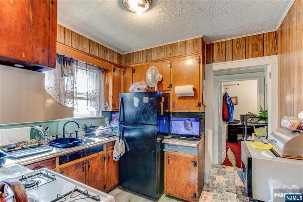 162 Summer Street Orange, NJ 07050 - Photo 16 of 29 a living room with furniture and a window