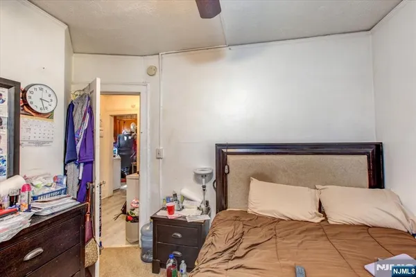 a bedroom with a bed and a closet