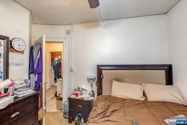 a bedroom with a bed and a closet