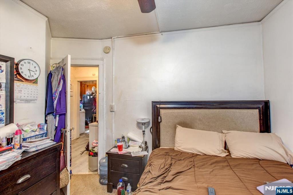 162 Summer Street Orange, NJ 07050 - Photo 20 of 29 a bedroom with a bed and a closet