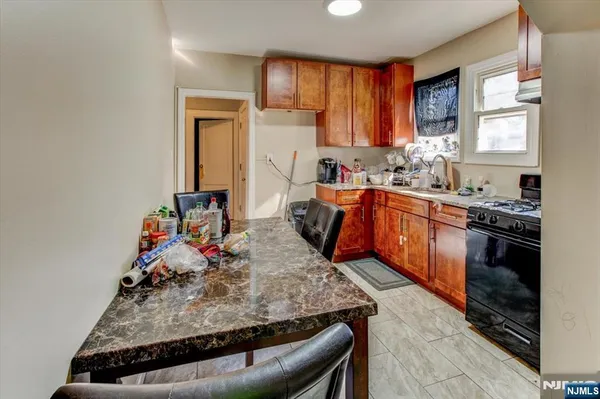 a kitchen with granite countertop lots of counter top space