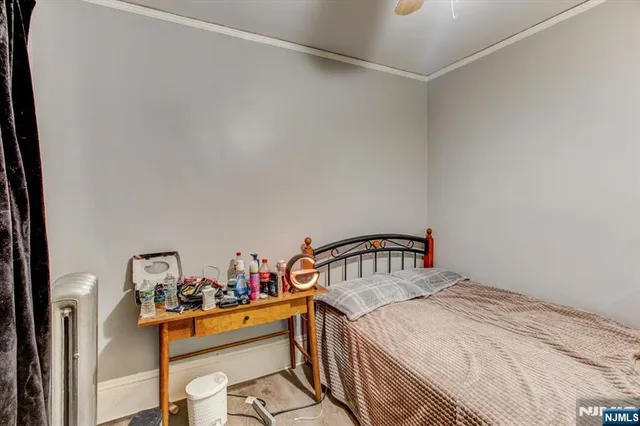 a bedroom with a bed and a table in it