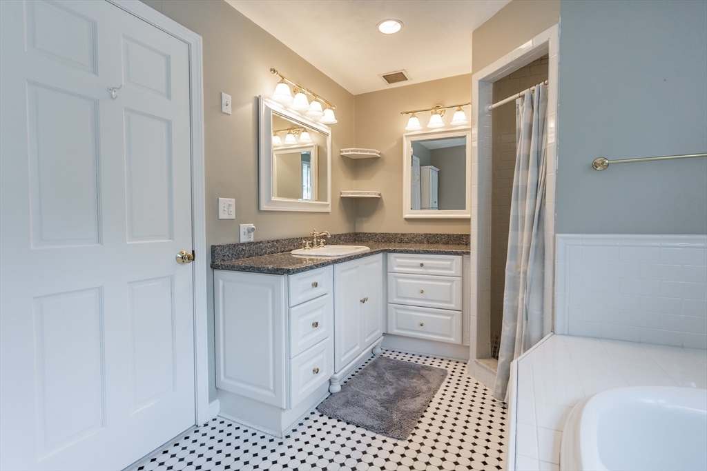 39 Nachaomet Road Lakeville, MA 02347 - Photo 21 of 42 a bathroom with a sink a vanity and a mirror