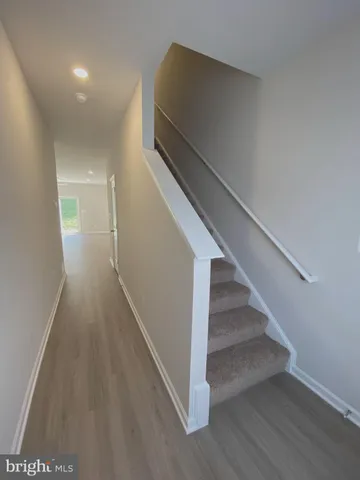a view of entryway with wooden floor