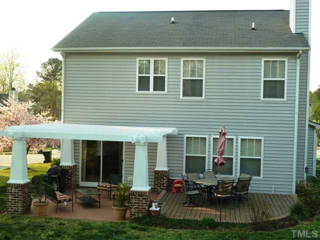 4112 Hopper Street Raleigh, NC 27616 - Photo 23 of 25 a backyard of a house with yard table and chairs