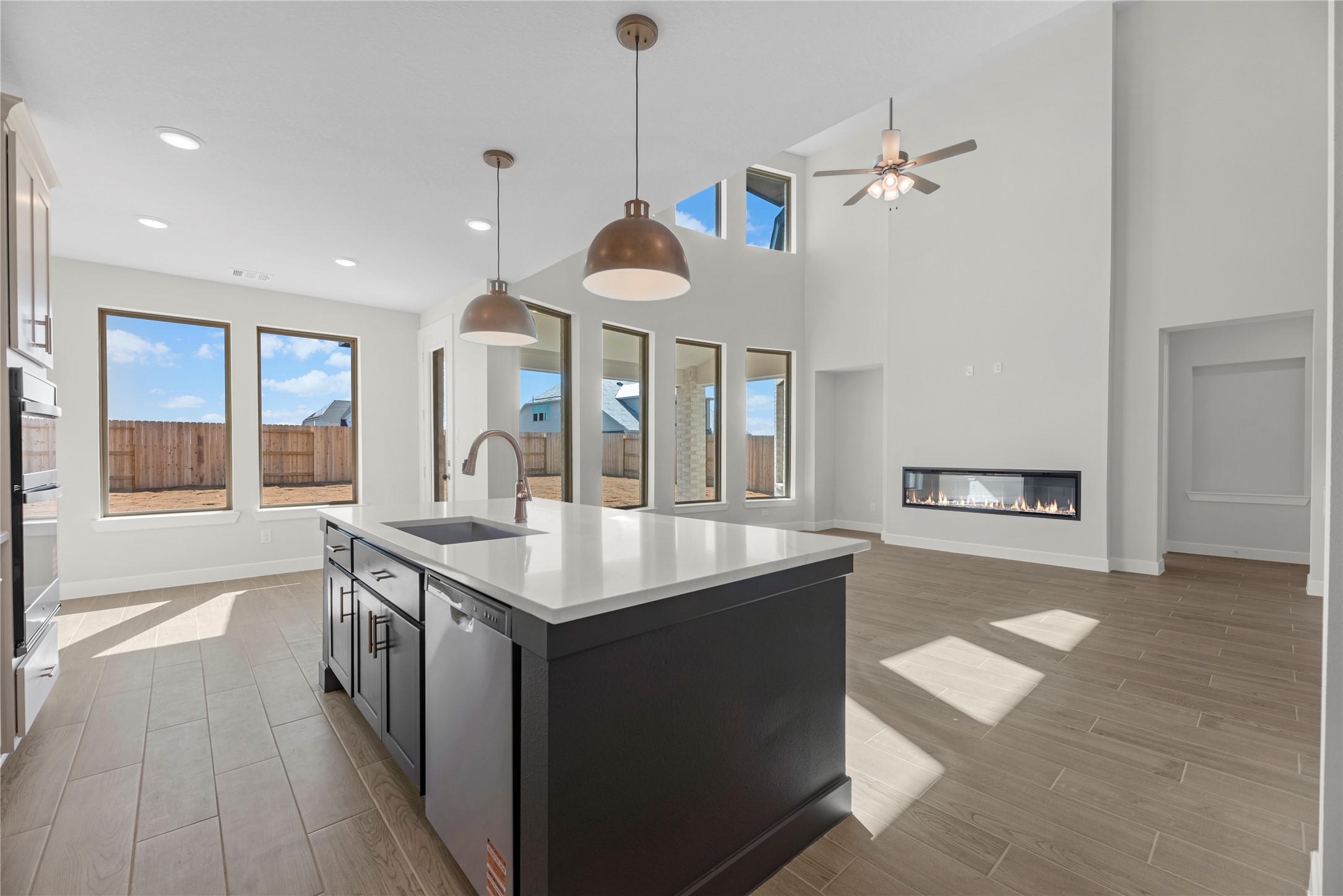 5023 Nesbit Path Rosenberg, TX 77471 - Photo 7 of 25 a kitchen with a stove and a wooden floor