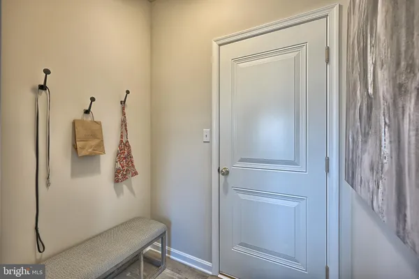 a kitchen with a refrigerator and cabinets