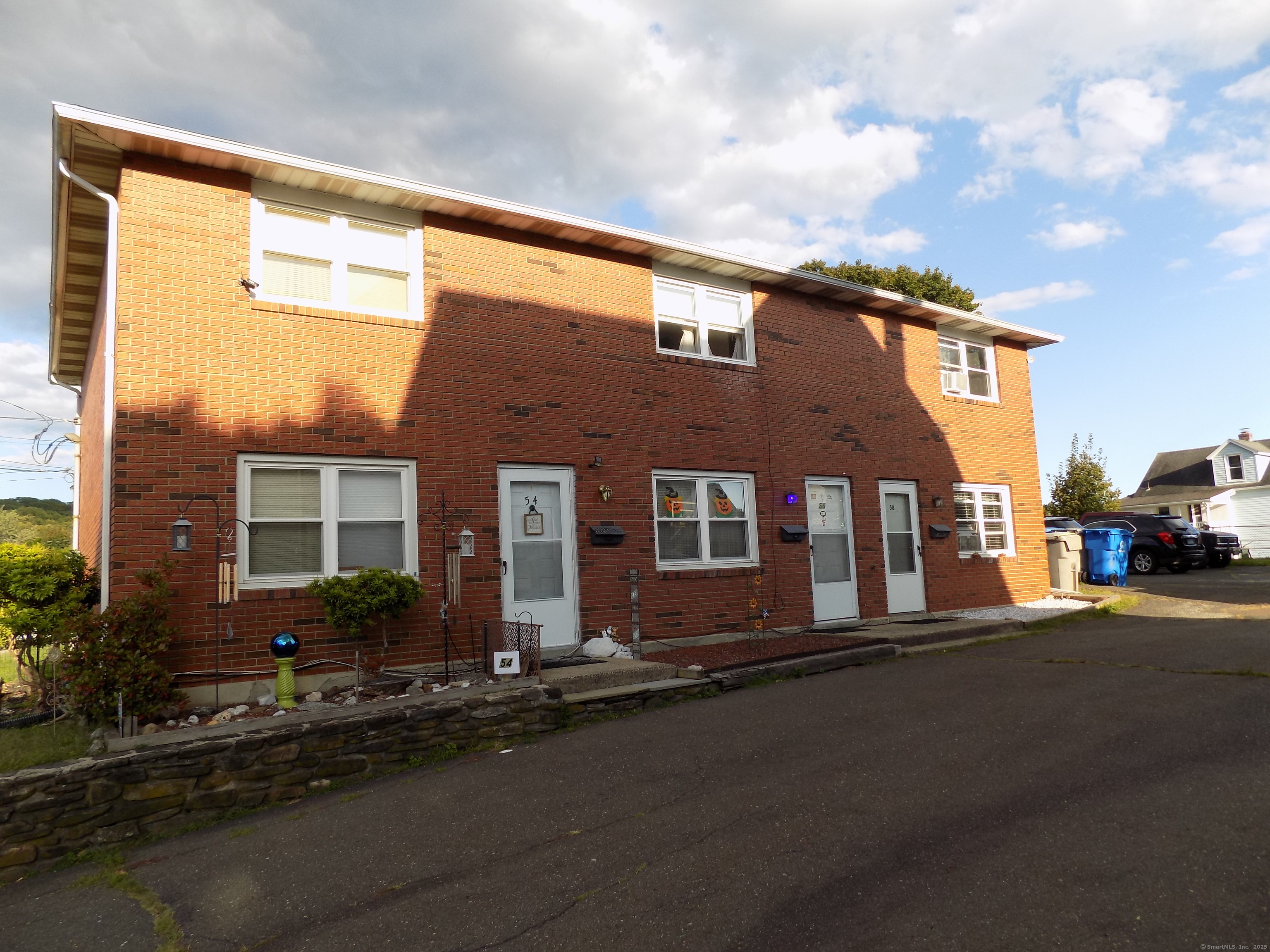 a front view of a house with yard