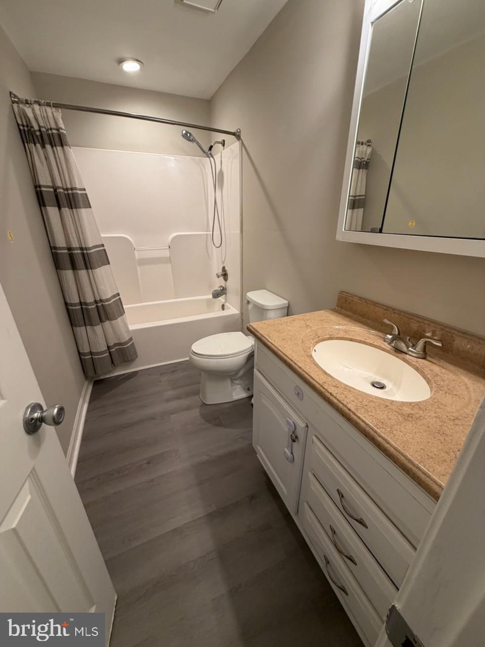 10310 Meadowview Drive Fredericksburg, VA 22408 - Photo 15 of 25 a bathroom with a granite countertop sink toilet and shower