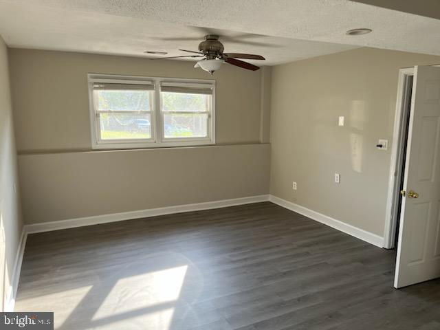 10310 Meadowview Drive Fredericksburg, VA 22408 - Photo 17 of 25 a view of an empty room with wooden floor and a window