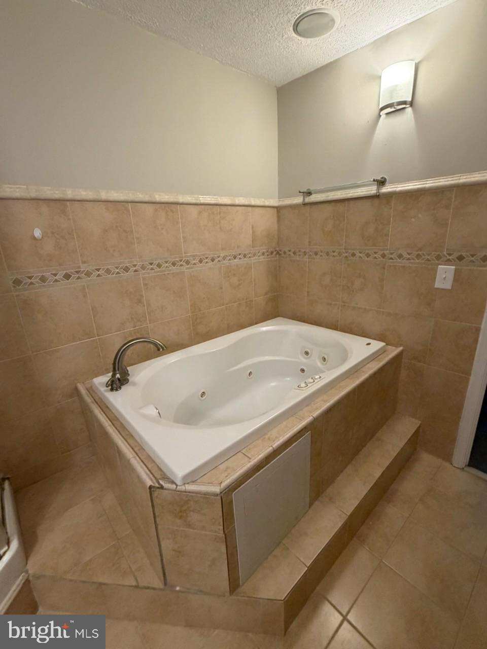 10310 Meadowview Drive Fredericksburg, VA 22408 - Photo 23 of 25 a bath tub sitting in a bathroom next to a sink