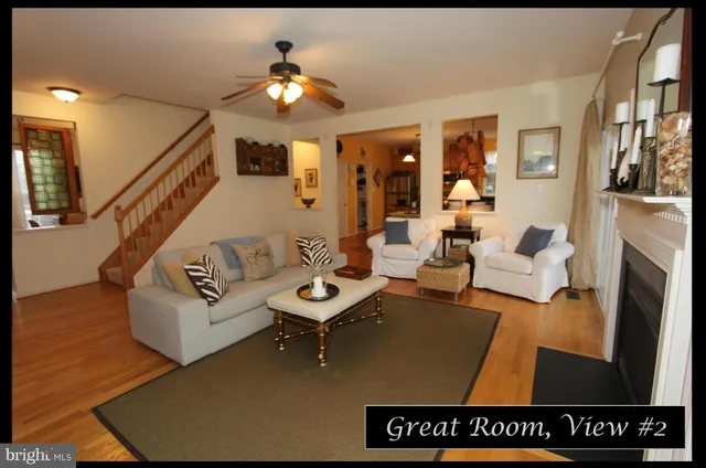 a kitchen with stainless steel appliances granite countertop a sink and a refrigerator