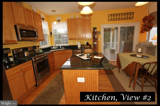 a kitchen with a table and chairs in it
