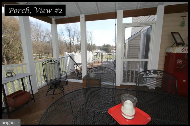 a view of a terrace with wooden floor and outdoor seating