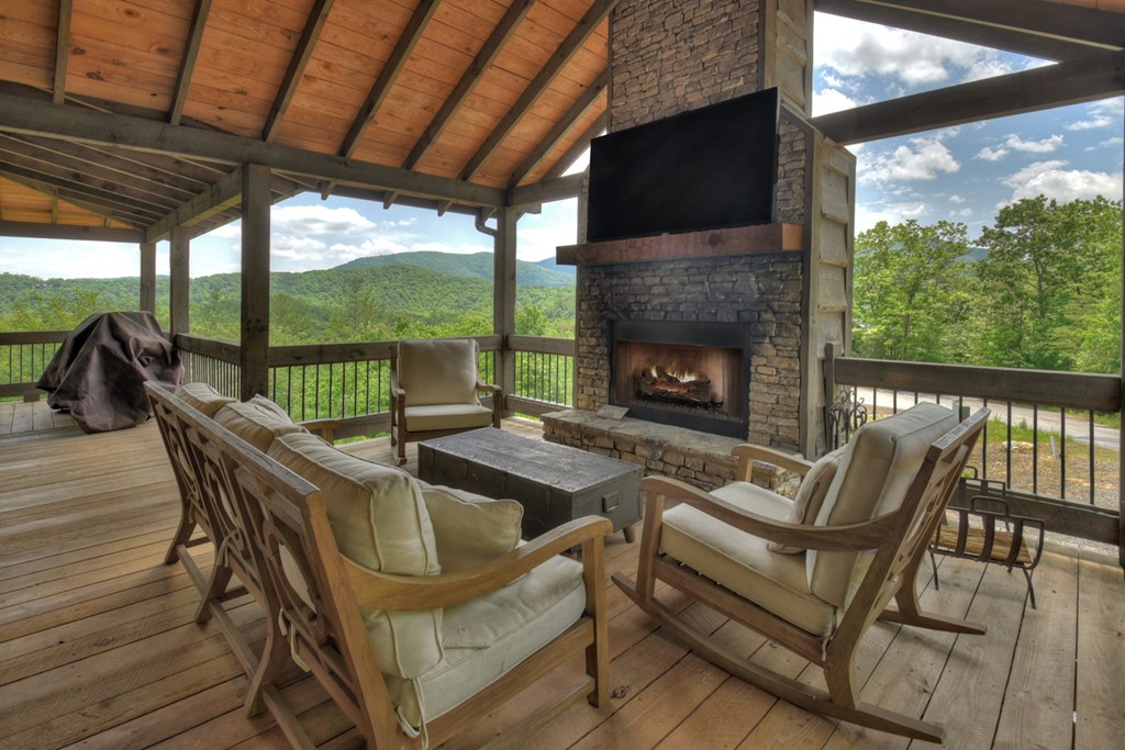 401 Foster Cove Road Epworth, GA 30541 - Photo 3 of 51 a view of a patio with a table chairs and a fireplace