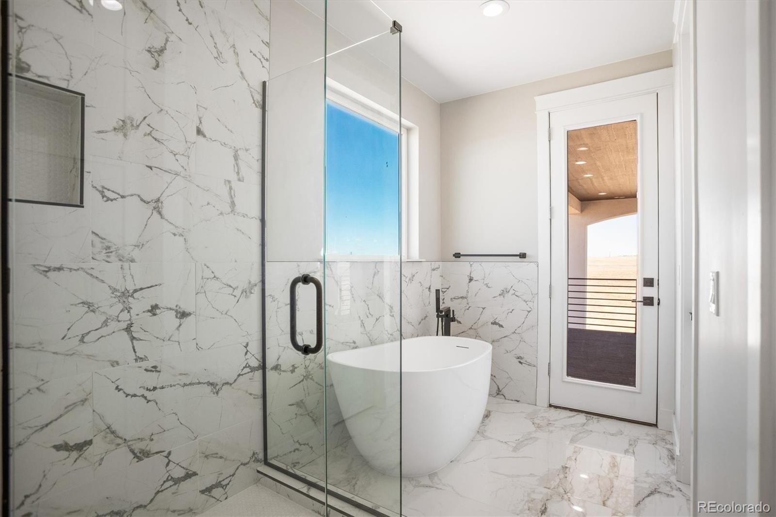 13350 Imboden Road Hudson, CO 80642 - Photo 30 of 50 a bathroom with a bathtub and shower