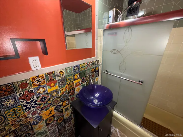a bathroom with a toilet and shower