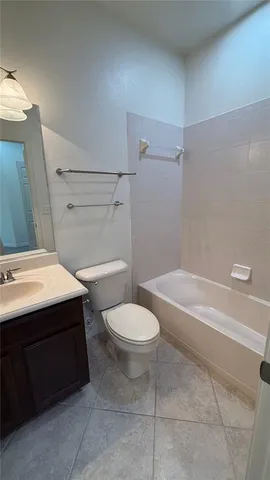 a bathroom with a sink a toilet and bathtub