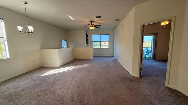 a view of a livingroom with a kitchen