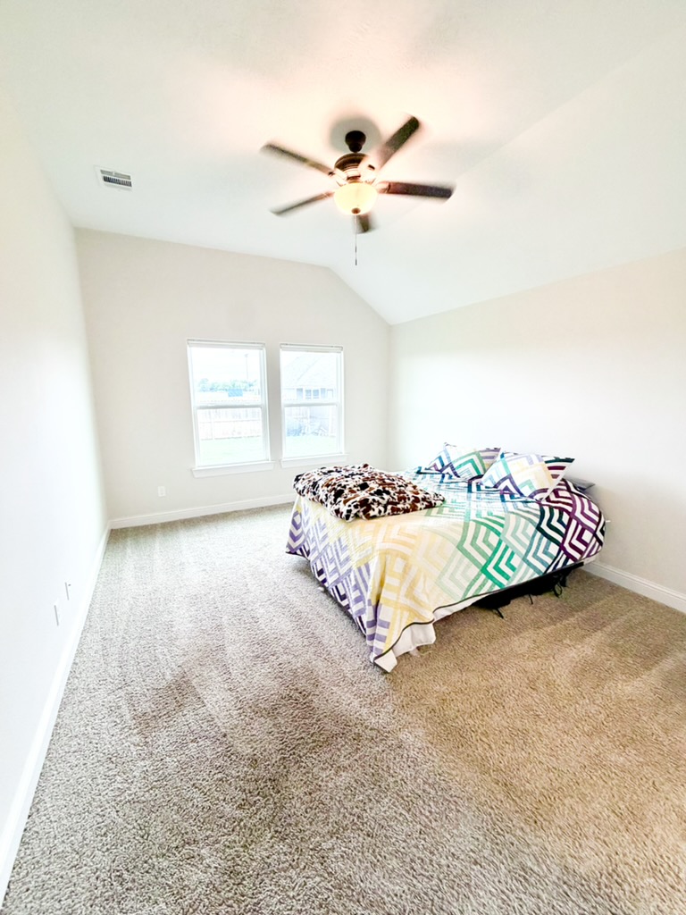 148 Turnrow Cove Somerville, TX 77879 - Photo 22 of 32 a bedroom with a bed and window