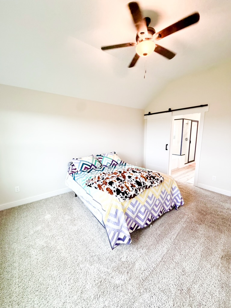148 Turnrow Cove Somerville, TX 77879 - Photo 23 of 32 a bedroom with a bed and dresser