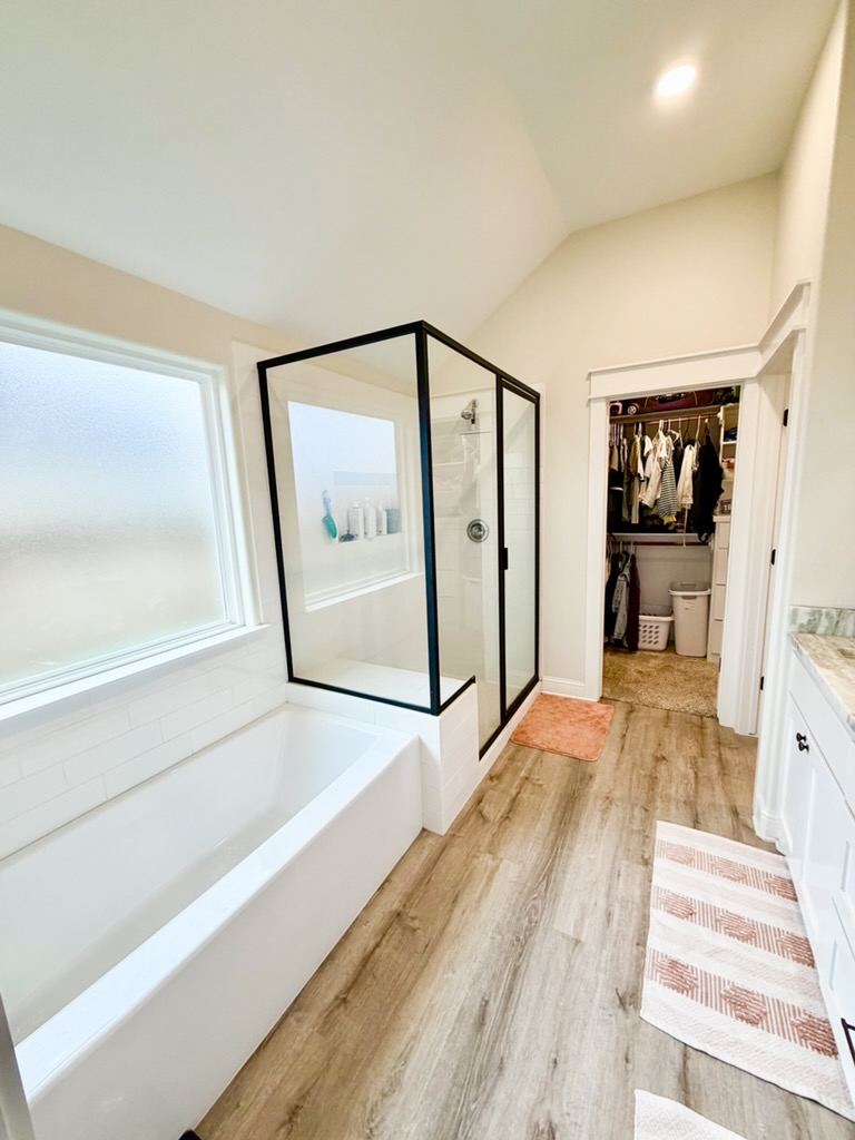 148 Turnrow Cove Somerville, TX 77879 - Photo 24 of 32 a view of a hallway with a bedroom and wooden floor