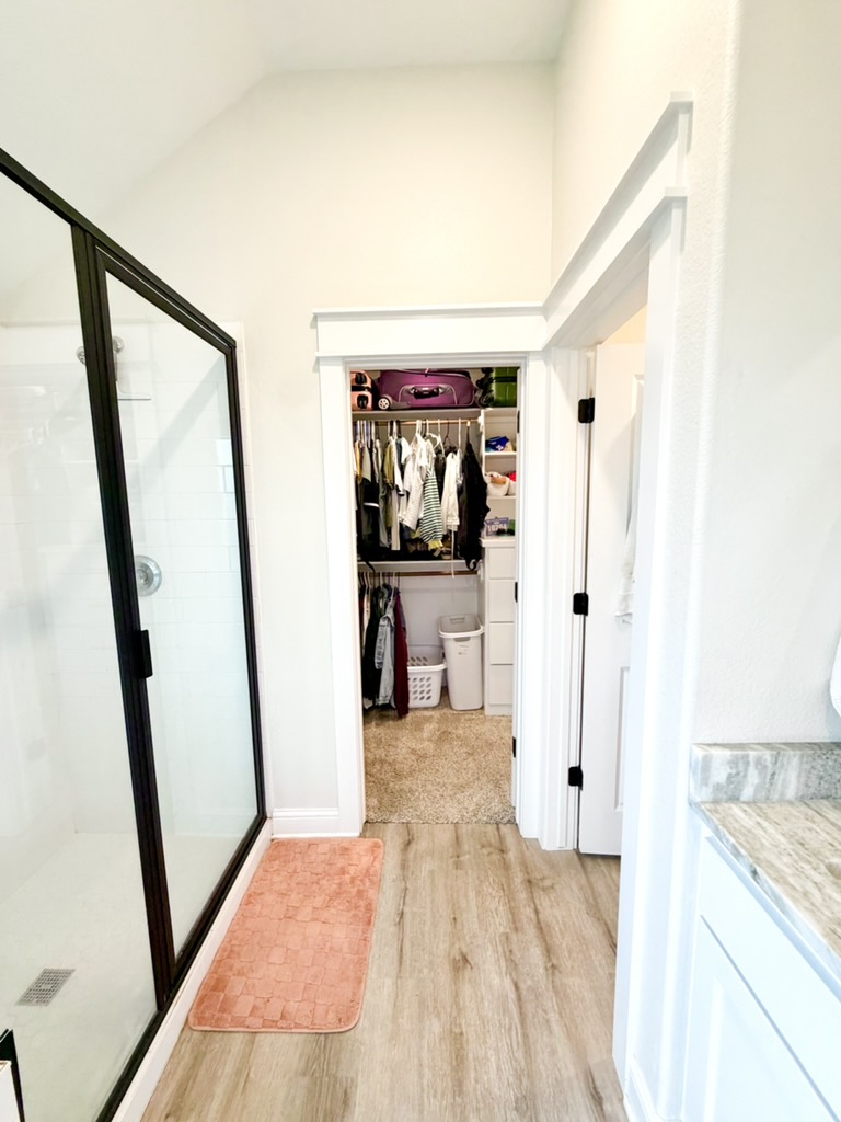 148 Turnrow Cove Somerville, TX 77879 - Photo 28 of 32 a view of a hallway with wooden floor and furniture