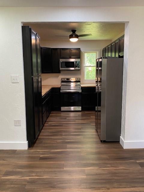 550 Herman Road Butler, PA 16002 - Photo 5 of 26 a kitchen with stainless steel appliances wooden floor and a refrigerator