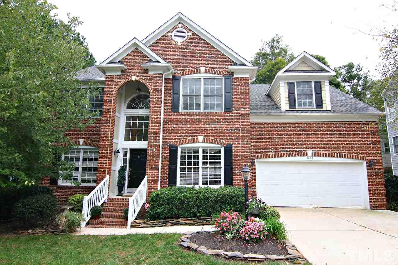 4109 Batiste Road Raleigh, NC 27613 - Photo 1 of 25 a front view of a house with a yard and outdoor seating