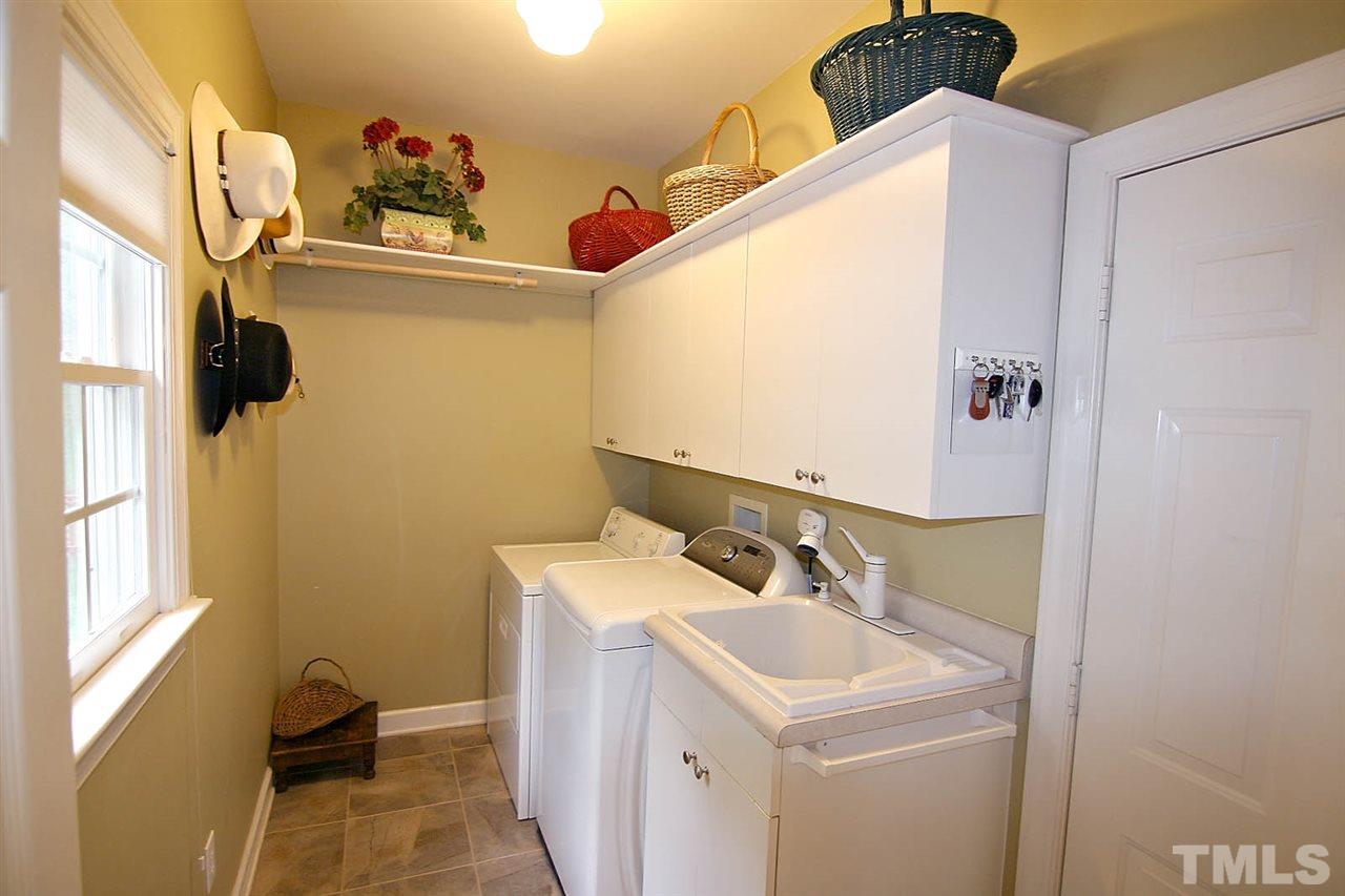 4109 Batiste Road Raleigh, NC 27613 - Photo 12 of 25 a bathroom with a sink and a mirror