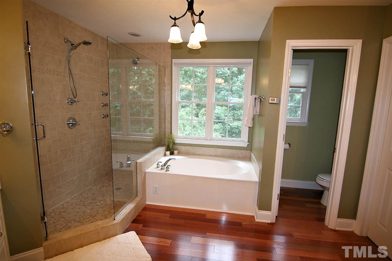 4109 Batiste Road Raleigh, NC 27613 - Photo 15 of 25 a bathroom with a shower and a bathtub