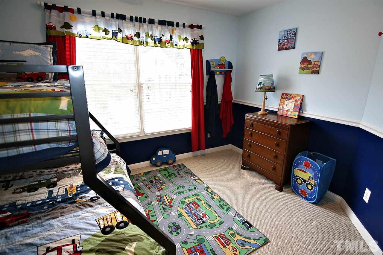 4109 Batiste Road Raleigh, NC 27613 - Photo 17 of 25 a bedroom with a bed and a window