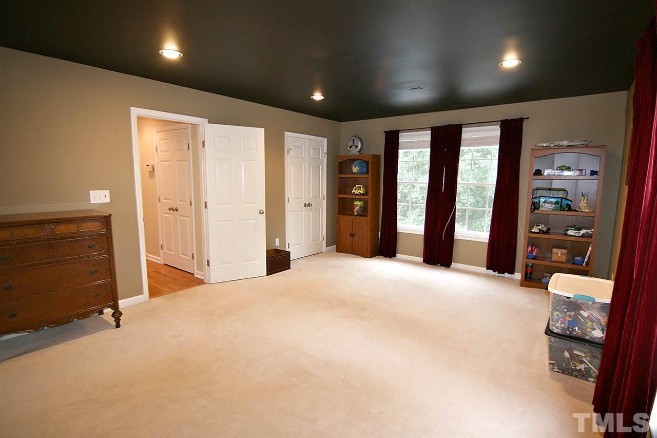 4109 Batiste Road Raleigh, NC 27613 - Photo 20 of 25 a large room with closet and mirror