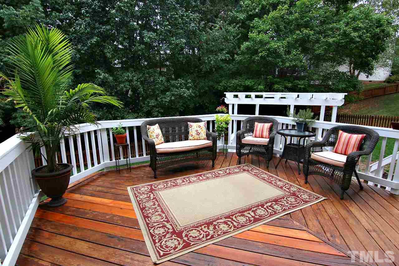 4109 Batiste Road Raleigh, NC 27613 - Photo 21 of 25 a balcony with furniture and wooden floor