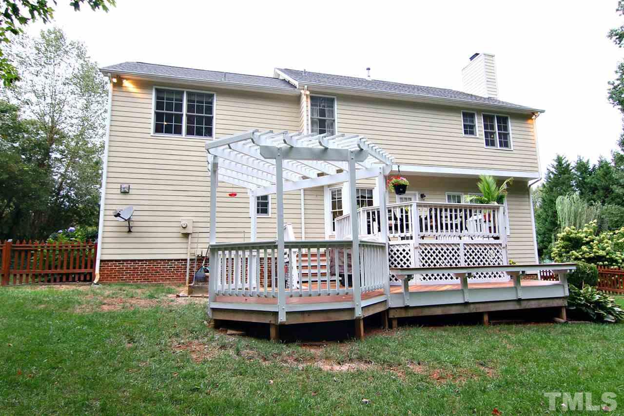 4109 Batiste Road Raleigh, NC 27613 - Photo 22 of 25 a view of a house with a yard and a deck