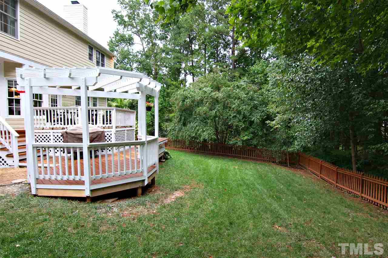 4109 Batiste Road Raleigh, NC 27613 - Photo 23 of 25 a view of a house with a yard and deck
