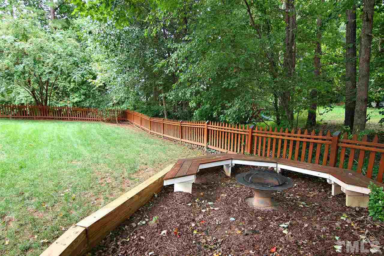 4109 Batiste Road Raleigh, NC 27613 - Photo 24 of 25 a balcony with trees in front of it