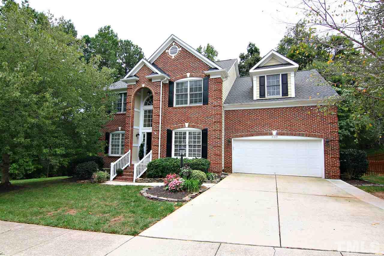 4109 Batiste Road Raleigh, NC 27613 - Photo 25 of 25 a front view of a house with a garden and garage
