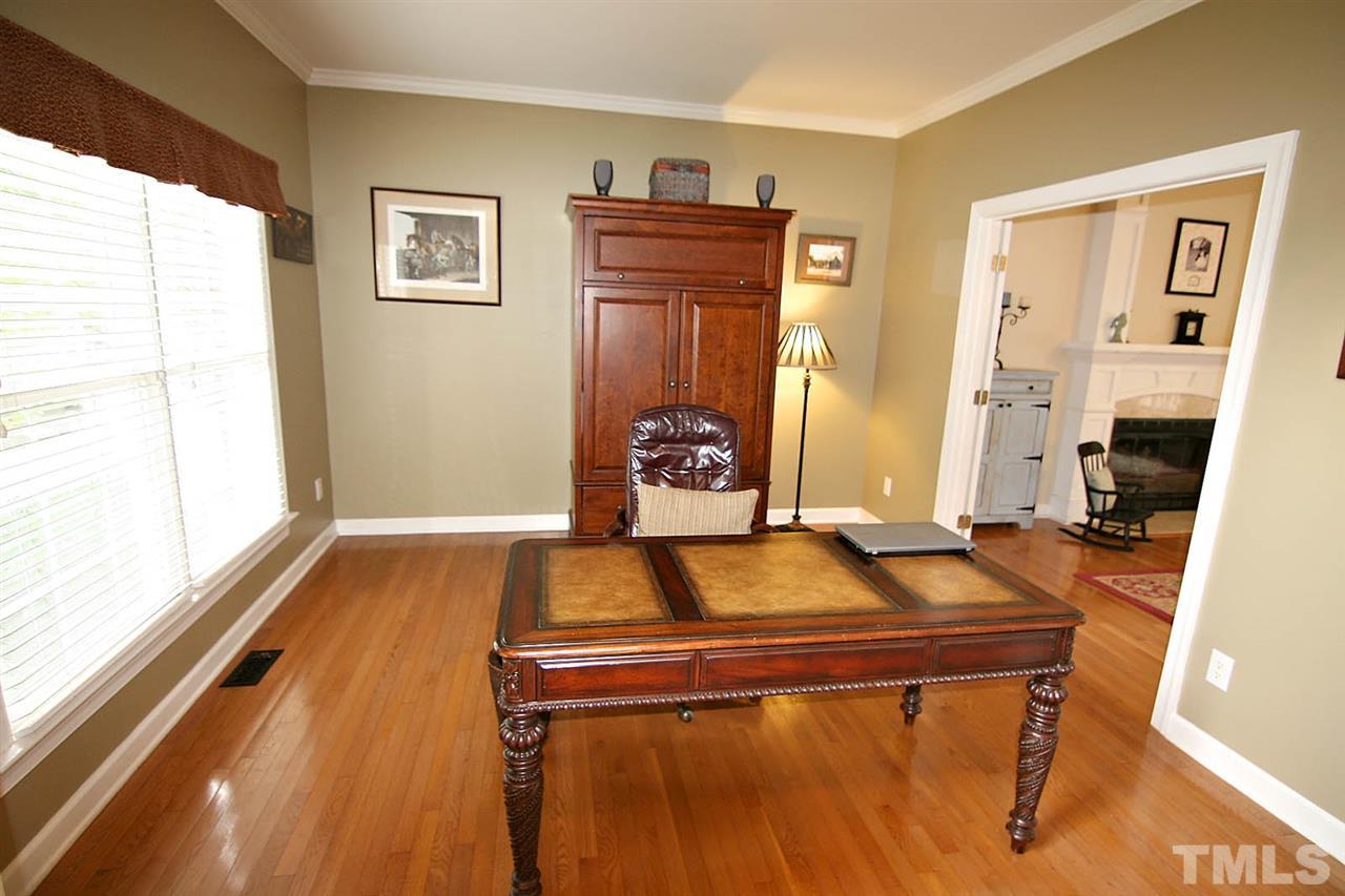 4109 Batiste Road Raleigh, NC 27613 - Photo 5 of 25 a living room with furniture and a table