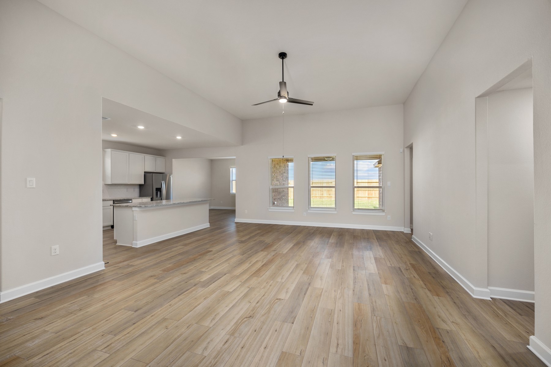 Upon entry, you are greeted with the spacious living room open to the kitchen. It's the perfect space for hosting friends and gathering with family.