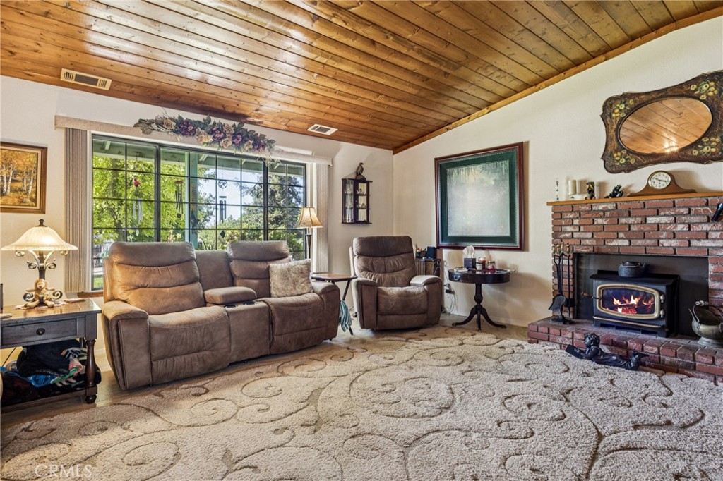 7050 Shale Rock Road Paso Robles, CA 93446 - Photo 13 of 45 a living room with furniture and a fireplace