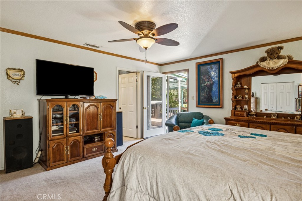 7050 Shale Rock Road Paso Robles, CA 93446 - Photo 17 of 45 a bedroom with a bed and a flat screen tv